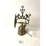 WALL MOUNTED ORNATE BRASS BELL.