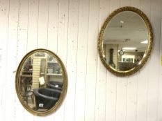 TWO OVAL BEVELLED MIRRORS IN GILDED FRAMES 50 X 65 CM