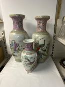 A TALL PAIR OF CHINESE FAMILLE ROSE VASES DECORATED WITH FIGURES, 58 CMS, AND A SMALLER SIMILAR