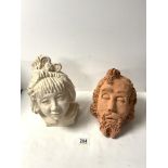 TWO SCULPTED CLAY HEADS OF A GIRL AND A BEARDED MAN.