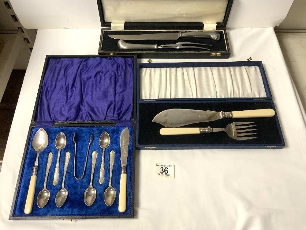 SET OF PLATED TEASPOONS, TONGS, AND SERVERS, A PAIR OF PLATED FISH SERVERS, AND A CARVING KNIFE