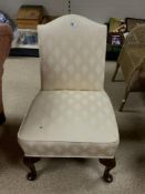 UPHOLSTERED BEDROOM CHAIR ON CABRIOLE LEGS.