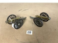 TWO MINIATURE BRONZE CANNONS ON IRON CARRIAGES.