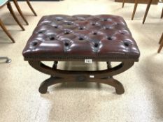 MAHOGANY X FRAME BUTTONED OX BLOOD LEATHER FOOT STOOL.