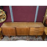 A 1960s TEAK SIDEBOARD WITH FOUR DRAWERS AND TWO CUPBOARD DOORS MADE IN SWEDEN, TROEDS DOMI MONTE,