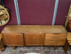 A 1960s TEAK SIDEBOARD WITH FOUR DRAWERS AND TWO CUPBOARD DOORS MADE IN SWEDEN, TROEDS DOMI MONTE,
