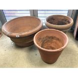 THREE TERRACOTTA CIRCULAR GARDEN PLANTERS, 70X38 CMS LARGEST.