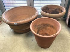 THREE TERRACOTTA CIRCULAR GARDEN PLANTERS, 70X38 CMS LARGEST.