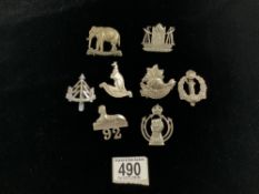 MILITARY BADGES OF WHICH SOME ARE SILVER