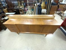 A MID-CENTURY TEAK SIDEBOARD WITH A DRINKS SECTION AND FOUR DRAWERS, 184X38X78 CM.