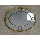 OVAL GILT FRAMED SECTIONAL WALL MIRROR, 96X76 CMS.