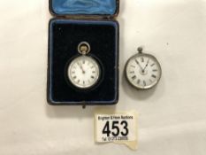 TWO VICTORIAN ENGRAVED SILVER CASE FOB WATCHES, 1 WITH ORIGINAL LEATHER CASE.