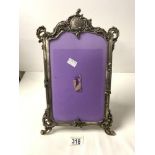WHITE METAL SCROLL WORKED PICTURE FRAME; 37CM