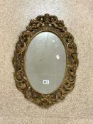 VINTAGE GILDED OVAL MIRROR DECORATED WITH CHERUBS HOLDING A CROWN 69 X 47CM