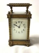 ORNATE BRASS CARRIAGE CLOCK; 15CM