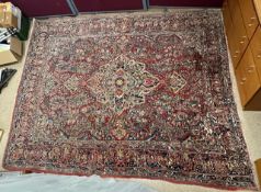ANTIQUE PERSIAN WOOLLEN RED GROUND PATTERNED CARPET, 310X250 CM.
