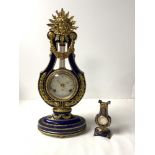 A BLUE AND GILT PORCELAIN MARIE ANTOINETTE CLOCK WITH A GERMAN FRANZ HERMAN MADE MOVEMENT; 38 CMS