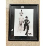 A FRAMED PHOTOGRAPH OF DAVID BOWIE AND LEAPING DOG.