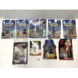 EIGHT STAR WARS ACTION FIGURE SETS IN BOXES.