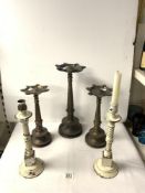 PAIR OF PAINTED BRASS CANDLESTICKS; 34 CMS AND 3 EASTERN BRONZE OIL LAMPS.