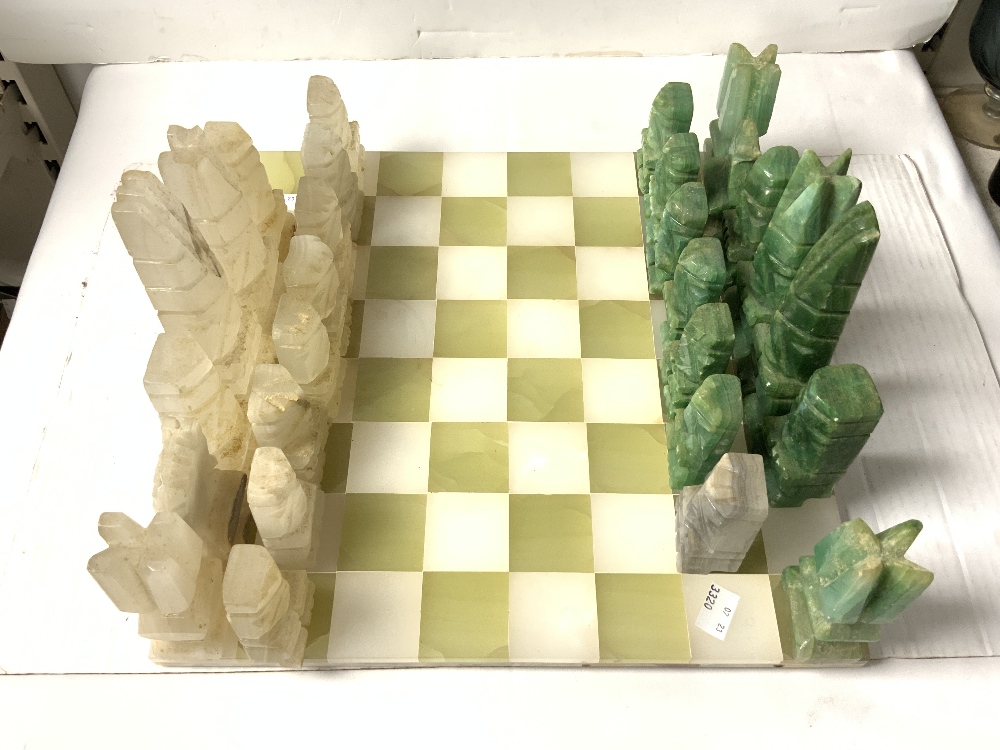 ONYX AND HARDSTONE AZTEC DESIGN CHESS SET AND BOARD, SOME DAMAGE TO PIECES. - Image 3 of 4