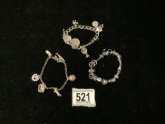 A HALLMARKED SILVER BRACELET AND CHARMS, ANOTHER STAMPED STIRLING AND ANOTHER BRACELET,