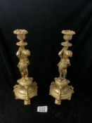 PAIR OF REGENCY DESIGN GILT METAL CANDLESTICKS WITH PUTTI SUPPORTS; 31 CMS.