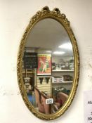 VINTAGE OVAL WALL MIRROR IN GILDED FRAME 61 X 36CM