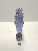 AMETHYST GLASS STATUE OF FIGURES EMBRACING; 32 CMS.