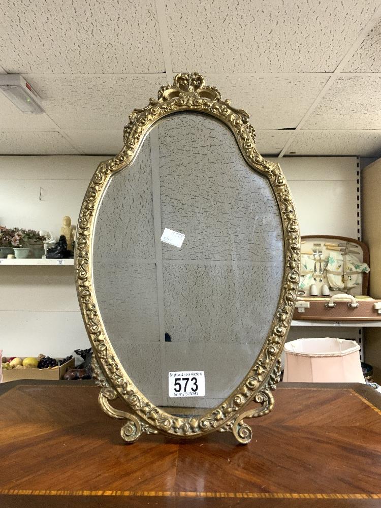 OVAL GILT FRAMED EMBOSSED EASEL MIRROR; 27X47 CMS.