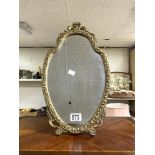 OVAL GILT FRAMED EMBOSSED EASEL MIRROR; 27X47 CMS.