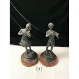 TWO METAL CASTS OF A GIRL AND BOY PLAYING MUSICAL INSTRUMENTS; 28CM