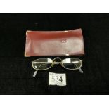 A PAIR OF CARTIER FRAMED GLASSES; IN CASE.