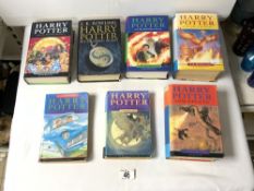 SEVEN HARRY POTTER HARDBACK BOOKS AND TWO PAPER BACKS.