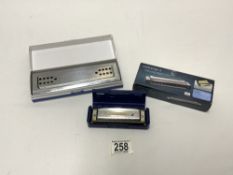 A SWAN HARMONICA AND TWO OTHERS.