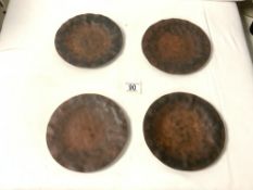 JAN BARBOGLIO - FOUR HAMMERED METAL PLATES; 19 CMS DIAMETER.