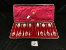 A SET OF 12 HALLMARKED SILVER RAT TAIL TEASPOONS AND PAIR OF NON MATCHING SUGAR TONGS; IN CASE;