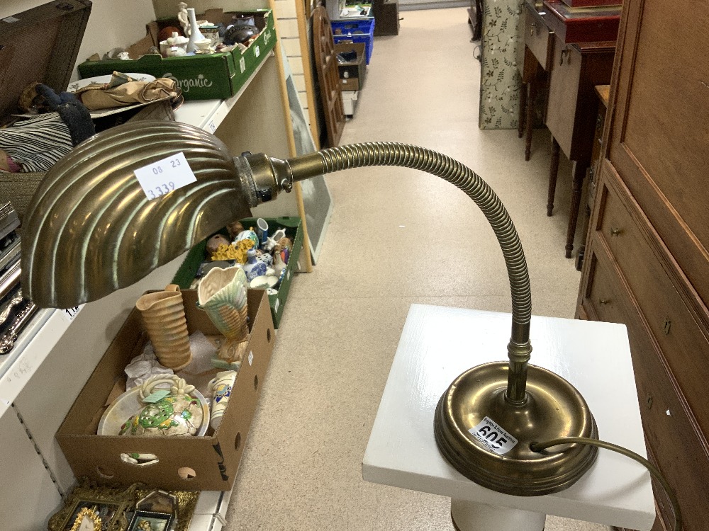 A VINTAGE BRASS FLEXI ANGLE POISE LAMP, WITH METAL SHELL SHAPED SHADE.