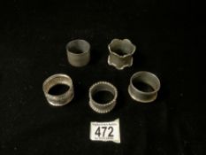FIVE HALLMARKED SILVER NAPKIN RINGS ONE WITH CAST BORDER; 112 GRAMS
