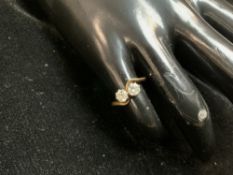 UNMARKED GOLD RING WITH HALF OF A CARAT OF DIAMONDS SET IN PLATINUM; SIZE J