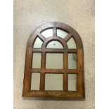 A HARDWOOD FRAMED ARCHED SECTIONAL MIRROR; 60X8O CMS.