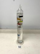 A GLASS GALILEO THERMOMETER, 34 CMS.