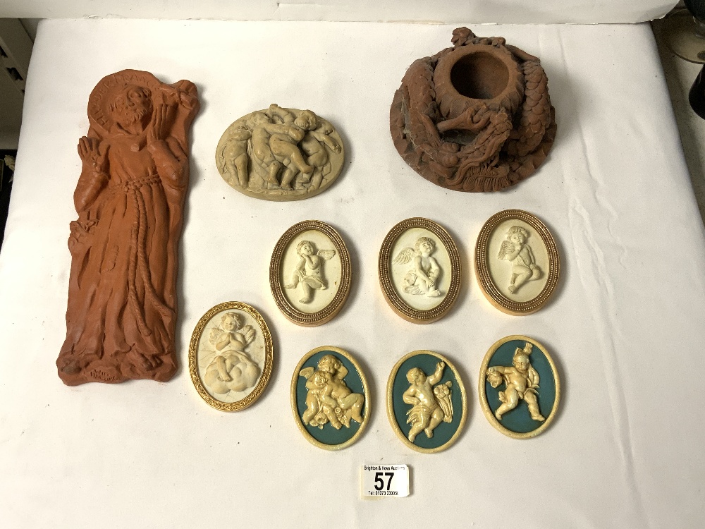 SEVEN OVAL MINIATURE PLAQUES OF CHERUBS, ANOTHER OF PUTTI AND TWO RED POTTERY PIECES.