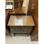 A SMALL OAK TWO DOOR CUPBOARD; 60X34X74 CMS.