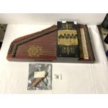 A VINTAGE ZITHER WITH GOLD LEAF DECORATION.