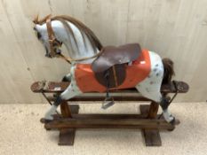 A VINTAGE PAINTED WOODEN ROCKING HORSE, 108X96.