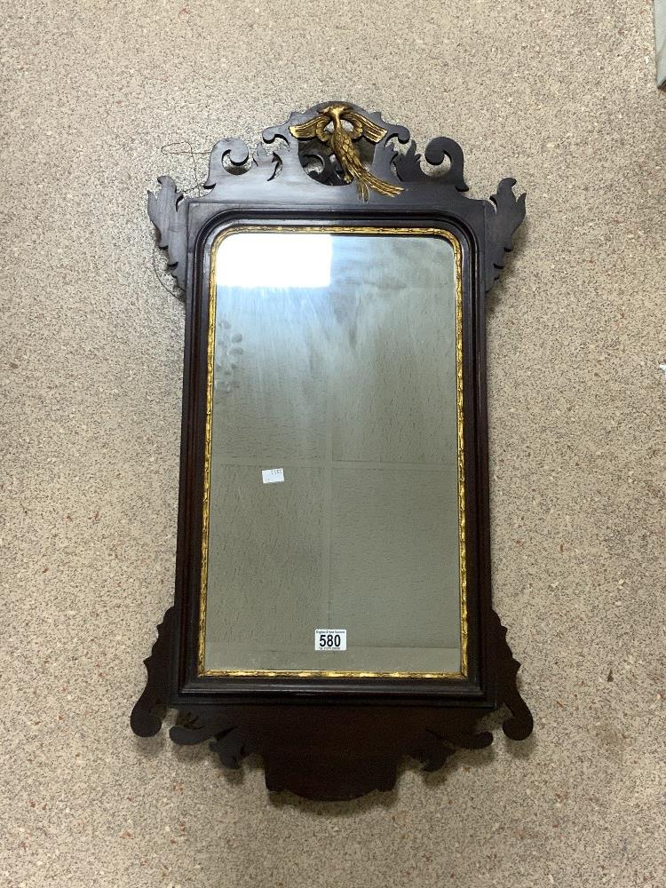 A REGENCY MAHOGANY AND GILT PHEONIX DECORATED FRETWORK WALL MIRROR; 48X90 CMS.