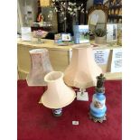 TWO PORCELAIN AND METAL MOUNTED TABLE LAMPS, AND TWO OTHER TABLE LAMPS.