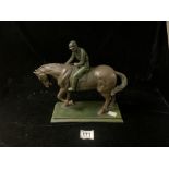 A BRONZED RESIN FIGURE OF A HORSE AND JOCKEY; 28X36 CMS.