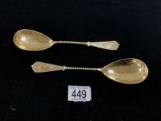 PAIR OF 800 SILVER GILT SERVING SPOONS WITH ORNATE SPIRAL TWIST AND CAST TERMINALS; 21CM; 129 GRAMS